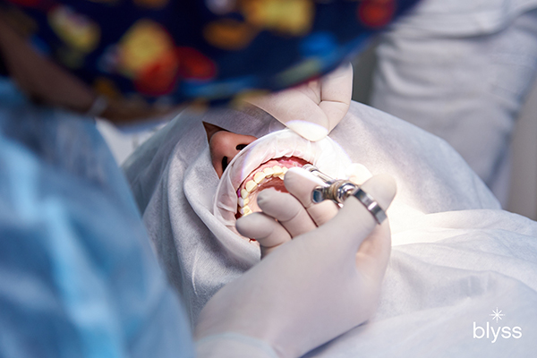 dentist injecting dental anesthesia to patient